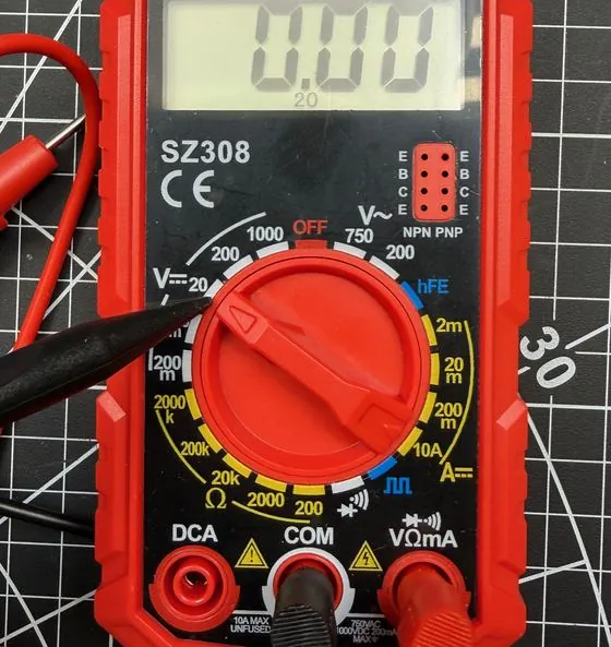 Multimeter dial set to the DC voltage 20 range